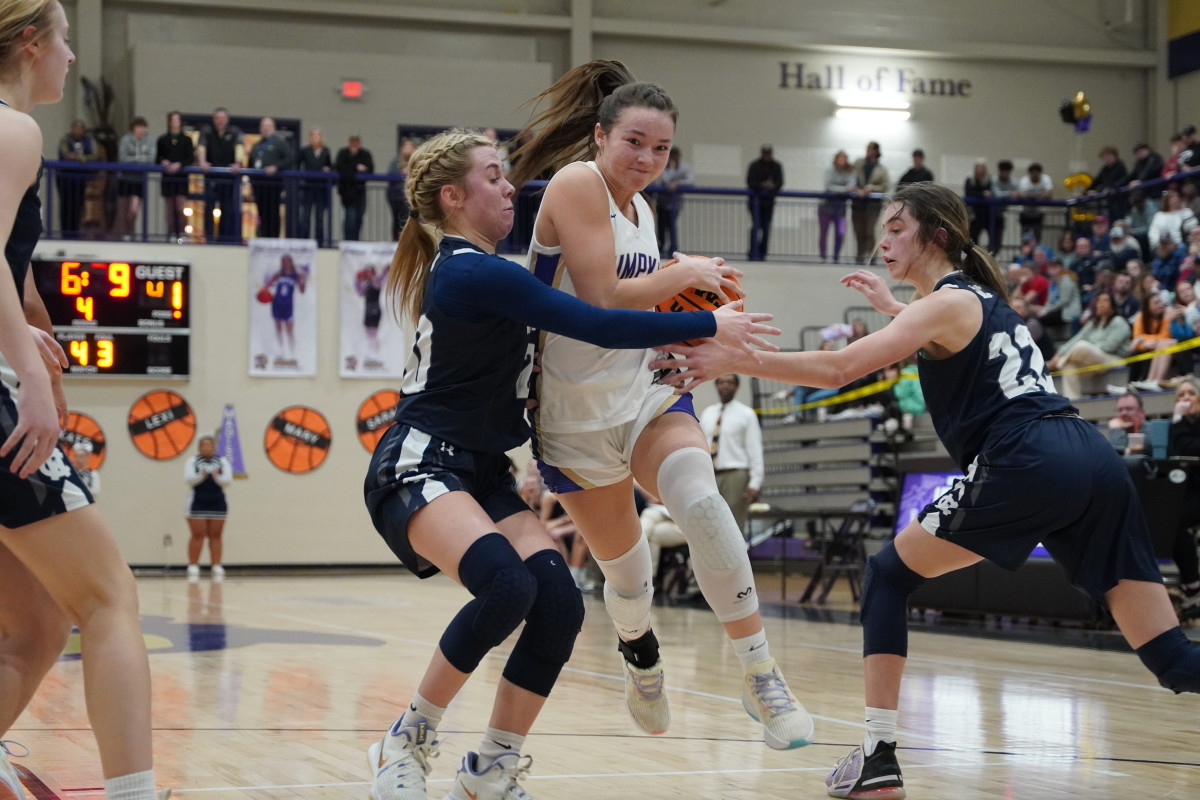 Lumpkin's Averie Jones drives through an aggressive double team to get to the basket in the second half. Jones scored 10 points on the night while primarily setting up her senior teammates to score throughout the game.