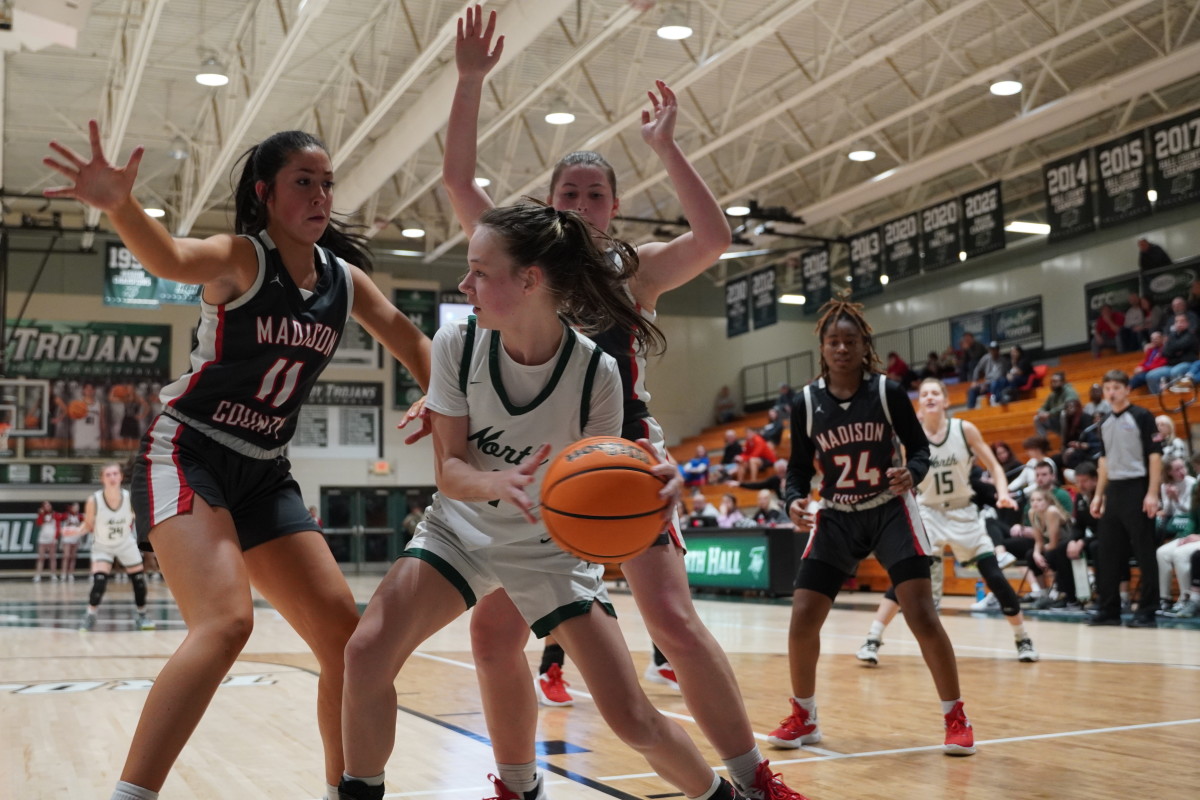 Senior Amelia Shoemaker commands the attention of the defense, drawing the double team before dishing the ball to an open teammate. Shoemaker finished the game with 10 points of her own while setting up her teammates throughout.