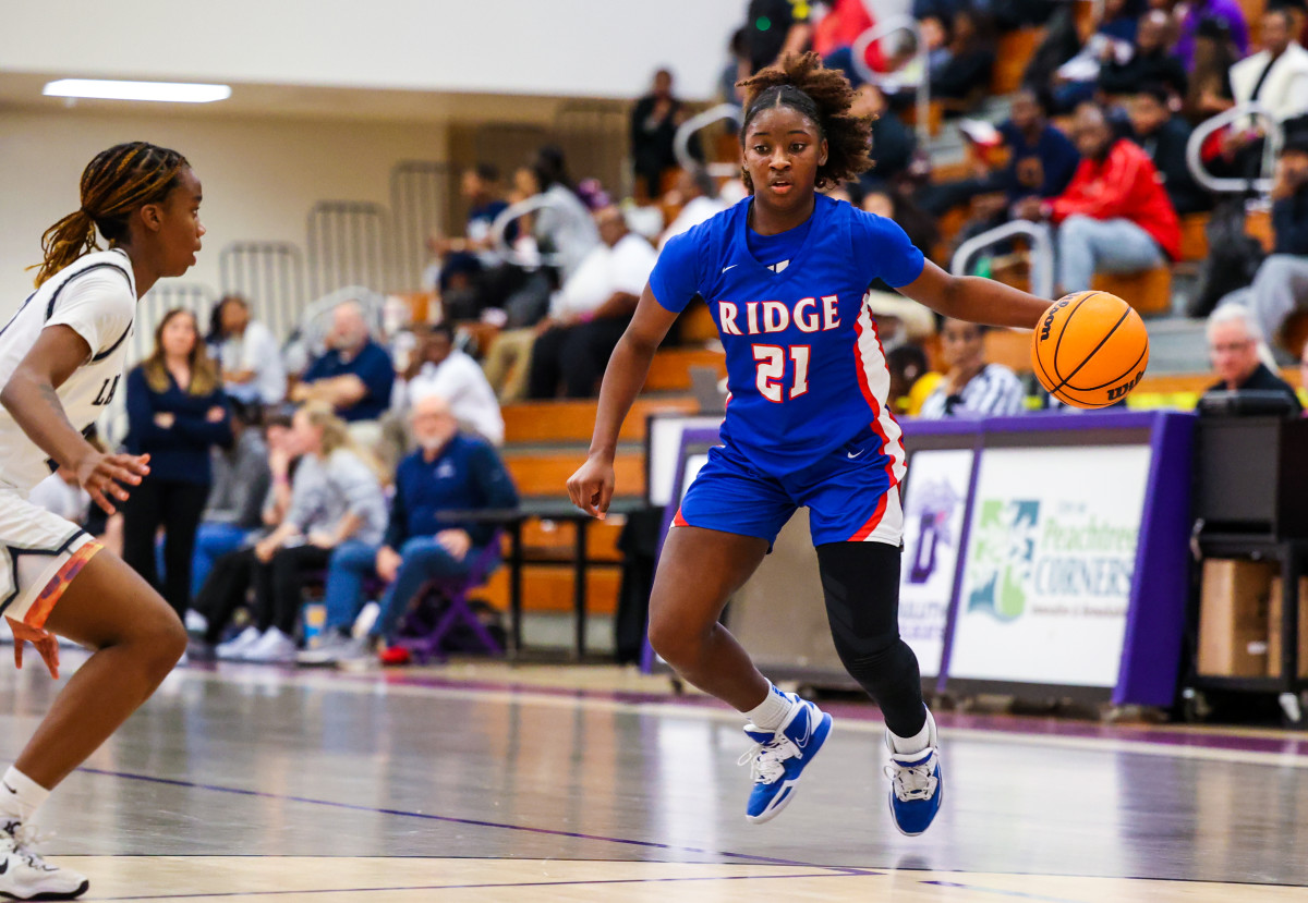 Peachtree Ridge's Sanaa Tripp (21) turned in a brilliant performance in her team's regional final loss to Norcross, scoring a game-high 27 points.