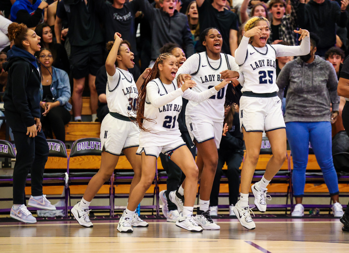 The Norcross bench begins the celebration as the closing seconds tick off of their team's second straight regional championship.