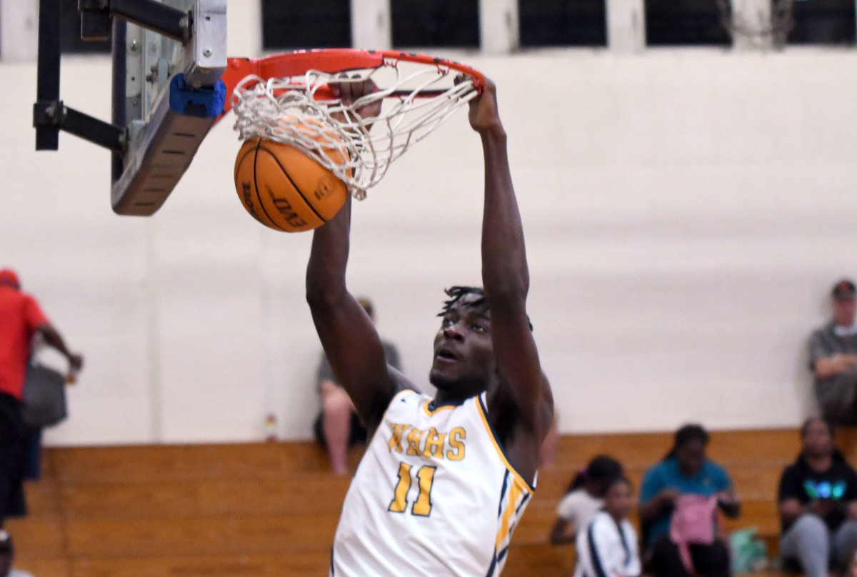 Winter Haven senior center Dylan James finishes off this second slam dunk of the first quarter against Sarasota Riverview on Thursday in a Class 7A, Region 3 quarterfinal at Winter Haven.