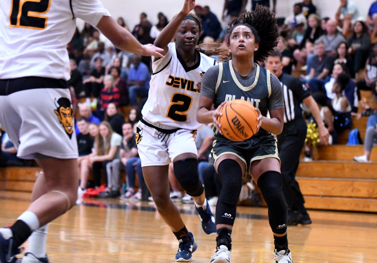 Tampa Plant point guard Azzariah Styles prepares to shoot while defended by Winter Haven small forward Jaeya Joseph during Class 7A, Region 3 final on Friday at Winter Haven.