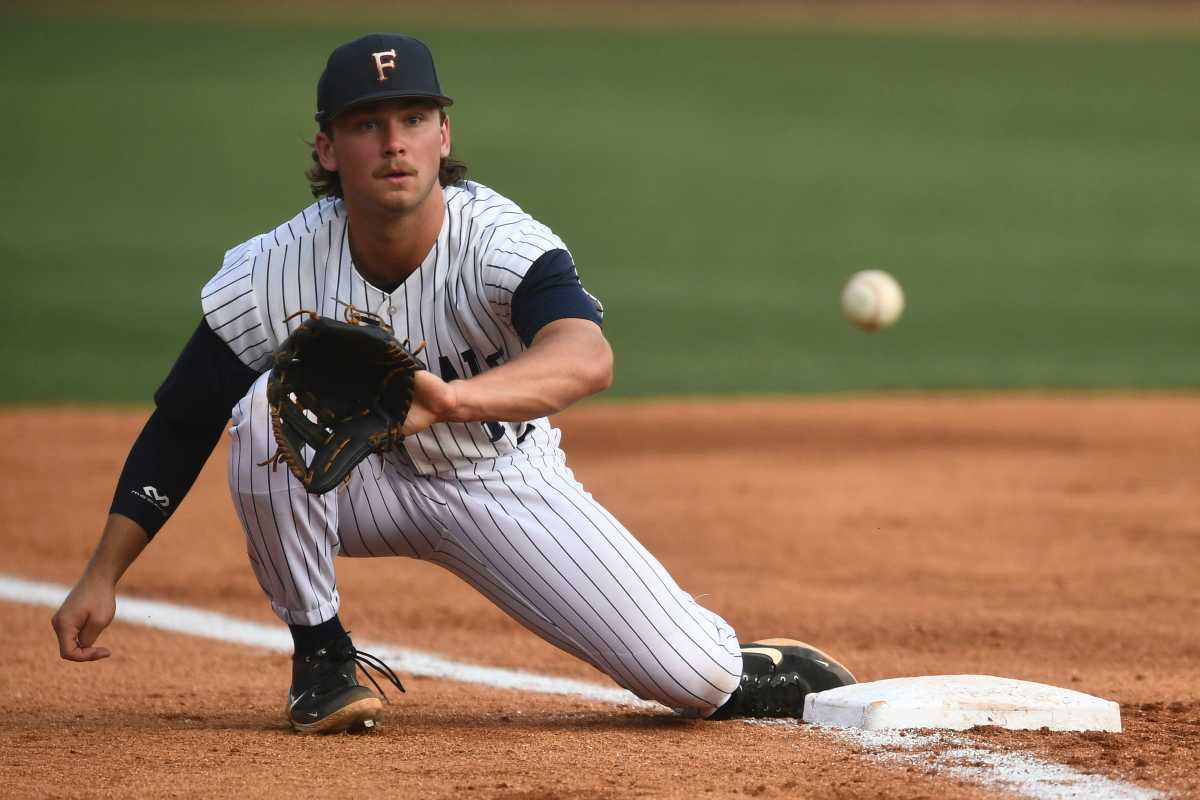 Farragut's Jett Johnston gets in front of a ground ball during the Region 2-4A high school baseball championship against Powell in Knoxville, Tenn. on Wednesday, May 18, 2022.