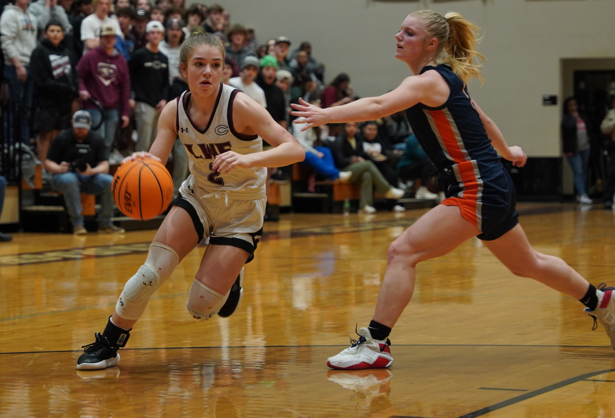 Addison Boyd drives past her defender toward the basket in the second half of Friday's Region Championship.