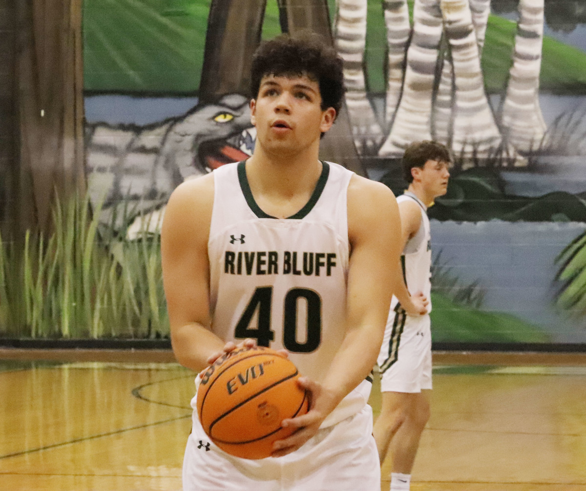Junior EJ Dunn lines up a free throw attempt during River Bluff's playoff victory on Saturday.