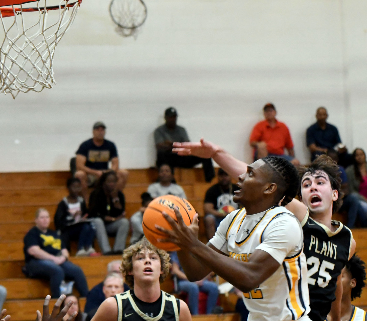 Winter Haven junior small forward Marcus Smothers drives in for a basket against Tampa Plant in a Class 7A Regional semifinal on Tuesday at Winter Haven.
