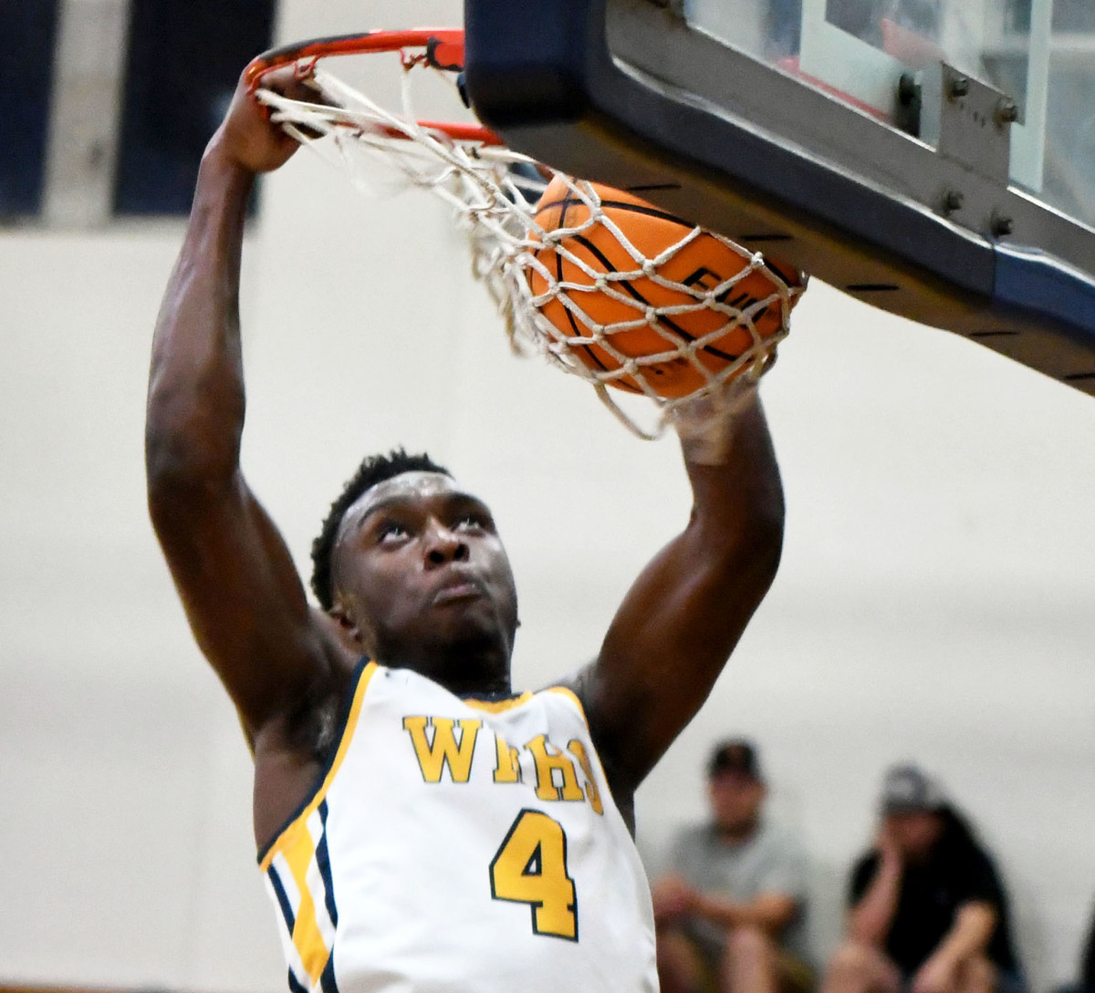 Winter Haven junior shooting guard Isaac Celiscar unleashes a slam dunk during the second quarter against Tampa Plant in a Class 7A Regional semifinal on Tuesday at Winter Haven.