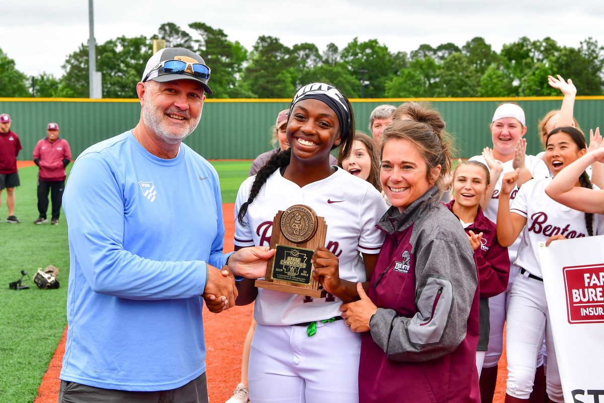 Alyssa Houston (center) pictured with Arkansas Activities Association administrator Steve Roberts (left) and Benton head softball coach Heidi Cox (right) is one of the most decorated senior softball players in the state and is headed to play collegiately at Stanford University. (Photo by Ted McClenning)