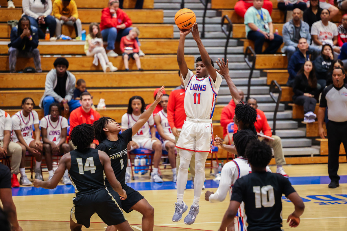 Byron Martin (11), who led Peachtree Ridge with 19 points, rises high for a jumper in the Lions rout of Mountain View to earn a place in the Class 7A Sweet 16.