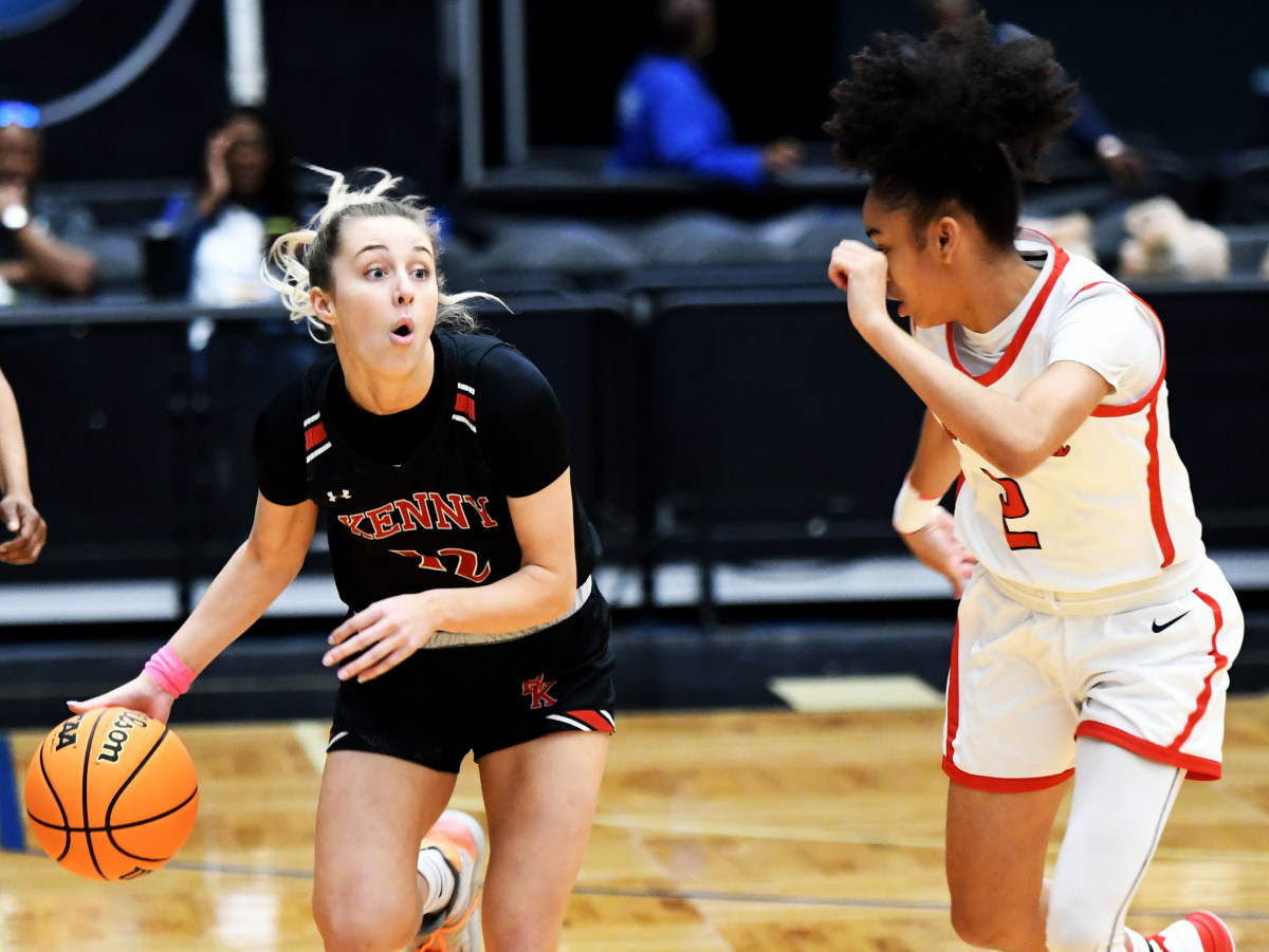 Bishop Kenny guard Sophia Rueppell drives the ball around Lake Highland Prep guard Ari Woodard during the FHSAA Class 4A girls basketball state championship game at the RP Funding Center in Lakeland.