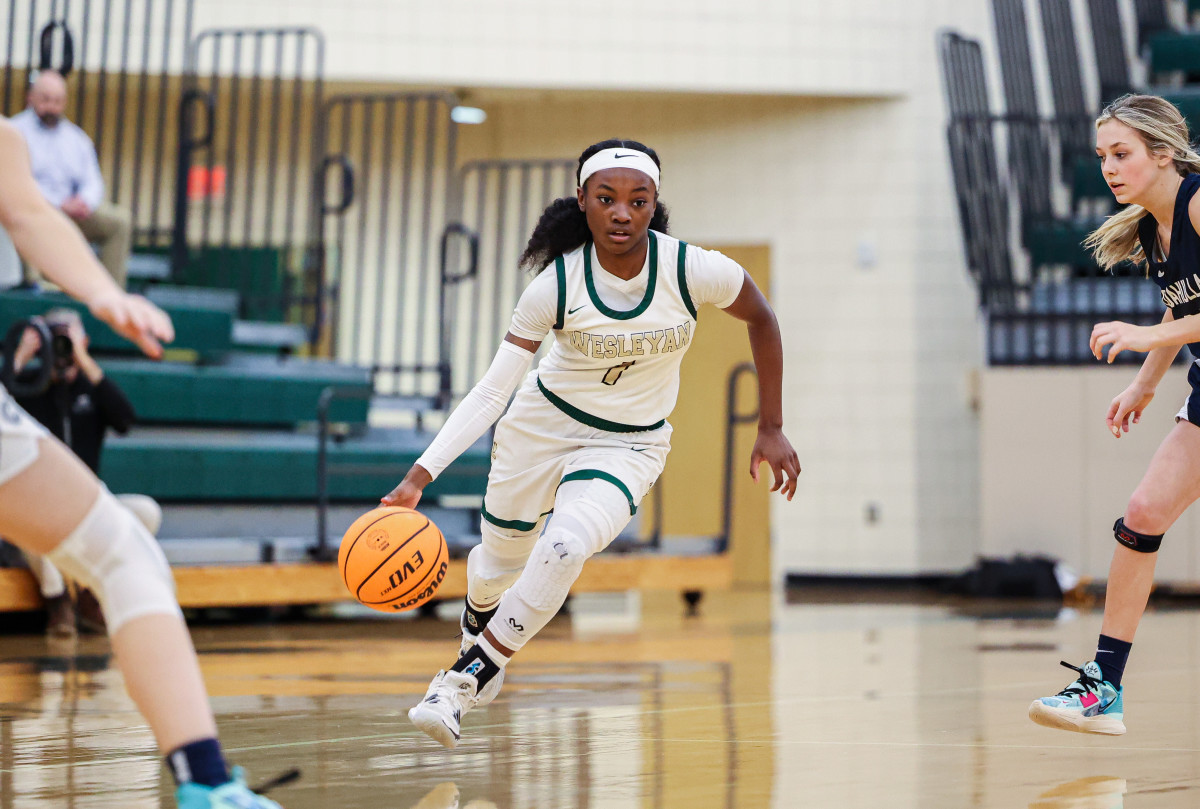 Wesleyan star guard Chit Chat Wright scored eight first quarter points, helping the Wolves build a commanding lead. She exited early, with her team coasting, but still finished with 15 points.