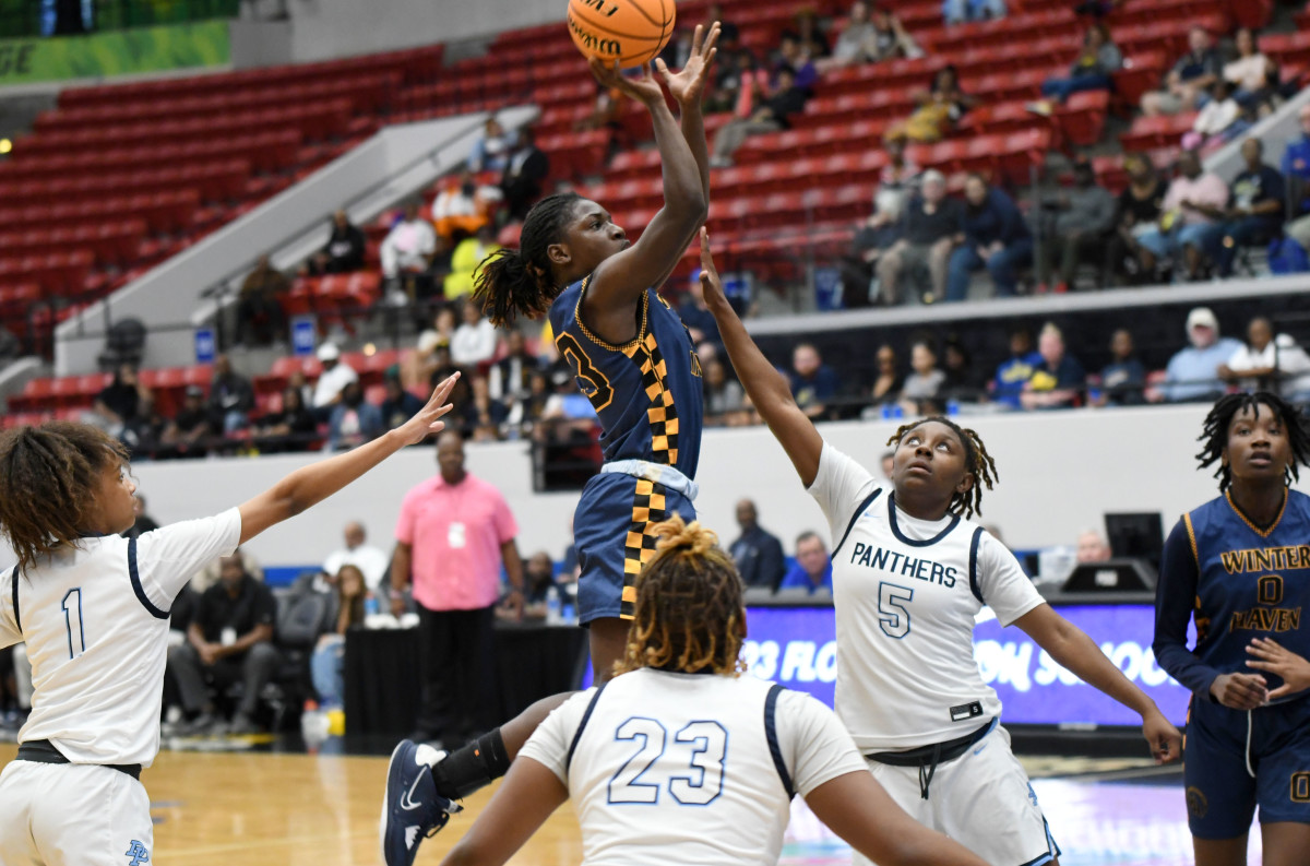 Winter Haven senior guard Bre’Asia Washington pulls up with a jump shot against top-ranked Dr. Phillips during the FHSAA Class 7A state championship game on Saturday at the RP Funding Center.