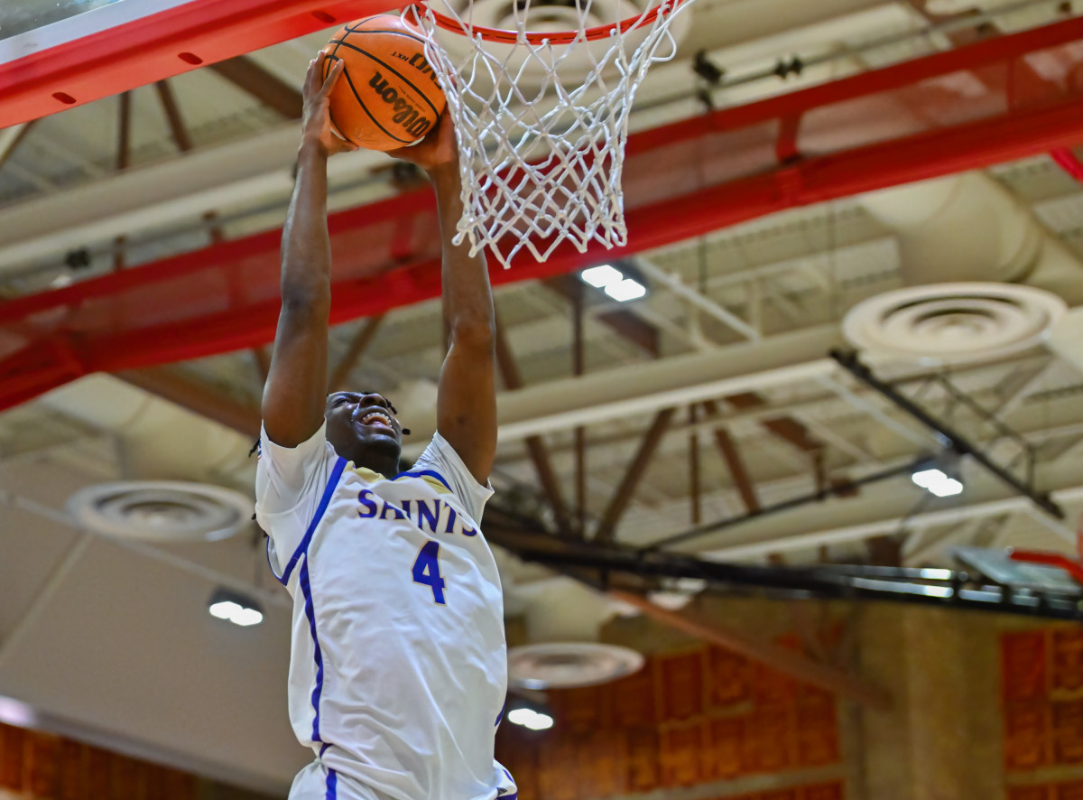 Jurian Dixon (4) was a menace on the offensive boards for the San Diego Section Open champions. Photo: Justin Fine. 