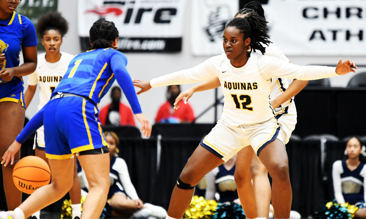 Charlotte guard Kamryn Corporan looks to drive around St. Thomas Aquinas guard Reina Green in the FHSAA Class 6A state championship game on Saturday at the RP Funding Center in Lakeland.