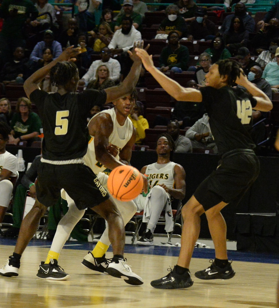 Conway's Cam Alston passes out of a double team, but his team struggled against the defense of Goose Creek all night in the 5-A Lower State championship game, scoring just 23 points.