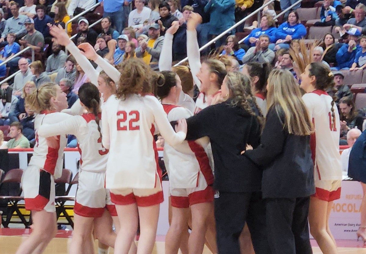 Archbishop Carroll players celebrate winning the PIAA Class 6A state championship on March 24, 2023