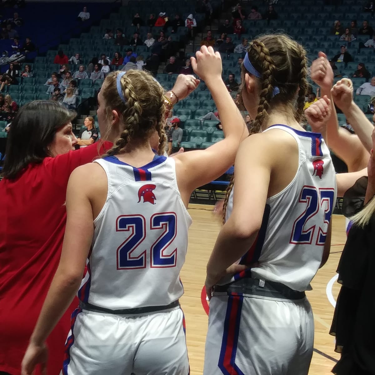 Bixby girls basketball coach Tina Thomas, left, huddles with her players during the Lady Spartans' run to the Tournament of Champions title during the 2021-22 season.