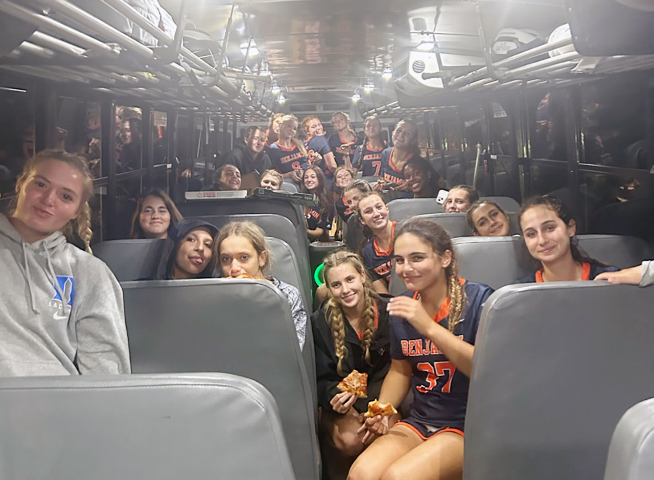 The Benjamin girls lacrosse team celebrates its 10-8 victory over Pine Crest, on the team bus, after a lightning storm halted the action with 2 minutes, 50 seconds remaing.