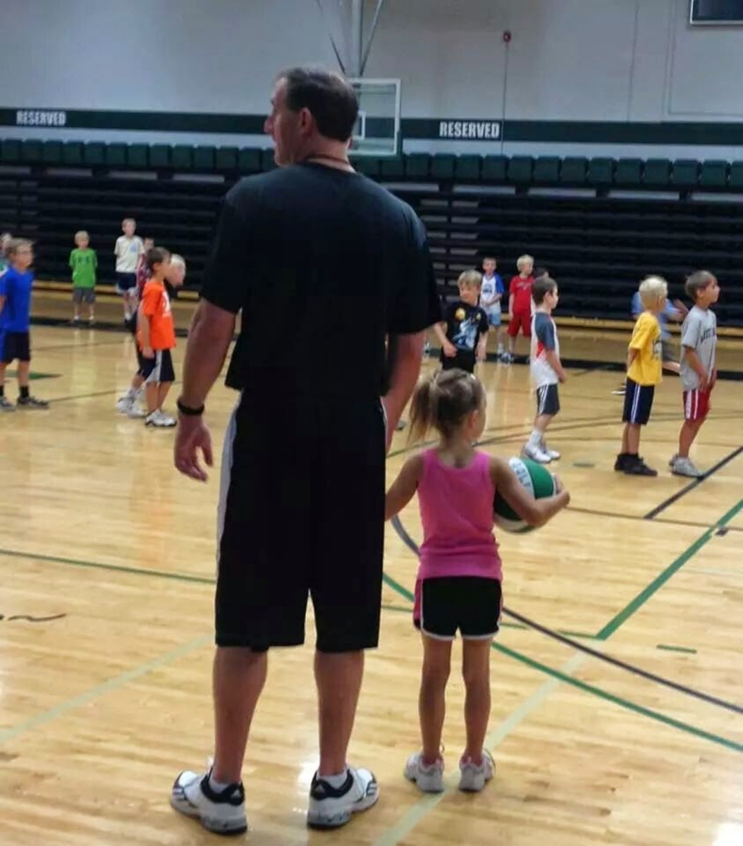 McKenna (right) with her dad Aaron at a kid's camp in Montana. 