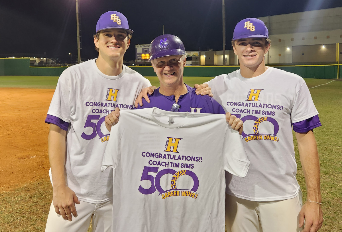 Hernando baseball coach Tim Sims, along with players Patrick Green (left) and Michael Savarese, show off a commemorative T-shirt marking the occasion of Smith's 500th career win. Both Green and Savarese homered in the historic victory, which came against Nature Coast in the Class 4A, District 6 tournament championship game.