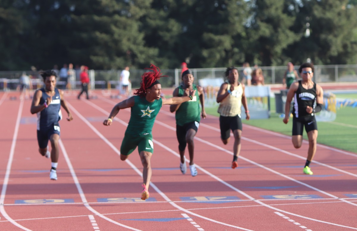 JeyQuan Smith crosses first in the CBL finals last week. Photo: John Murphy. 