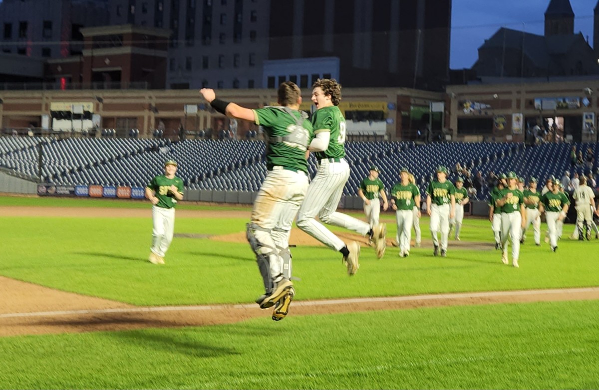 St. Vincent-St. Mary third baseman Zack Kurkey and catcher Daniel Krabill celebrate after STVM defeated Archbishop Hoban 5-2 Friday night at Canal Park in Akron. (Photo: Ryan Isley)  