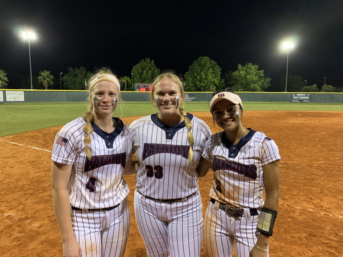 Lake Brantley seniors Kiley Strott (4), Bristin Bordeau (33) and Kiara Beltre (3) are all smiles after leading the Patriots to a 10-0 victory against Port Orange Spruce Creek in the Class 7A, Region 1 championship game.