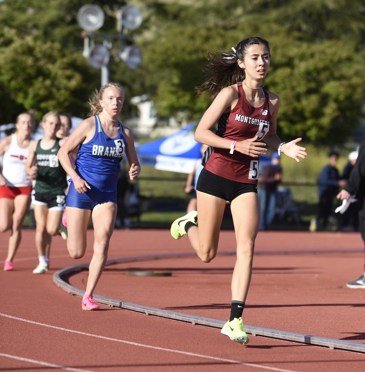 Montgomery sophomore Hanne Thompson, in front, will have a tough time repeating at 3200 because, unlike last season, she is attempting to double in the 1600. Photo Eric Taylor