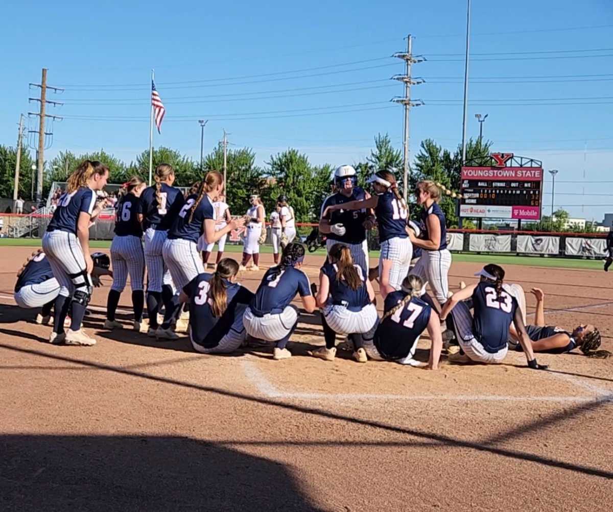 Sydnie Watts (No. 5) celebrates her home run in the regional final with her teammates 