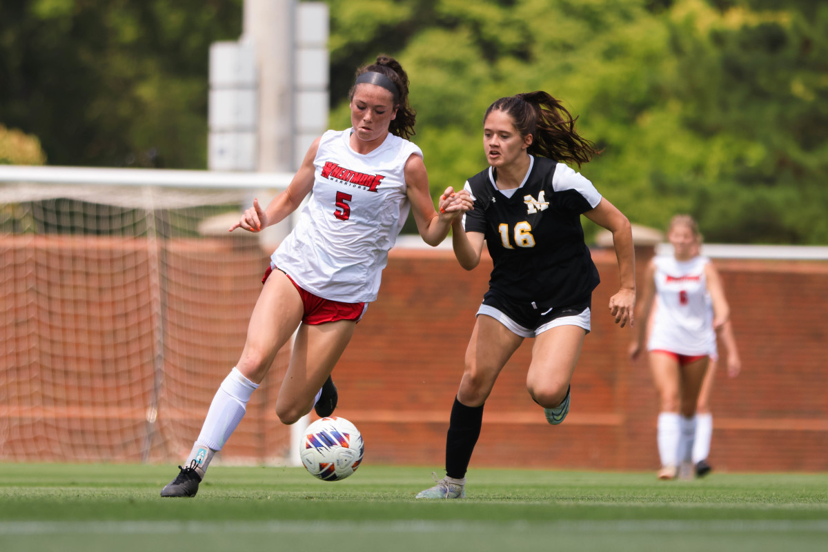 Wheatmore's Ellie Garrison (left) controls the ball during Saturday's NCHSAA 2-A state championship soccer game against Manteo.