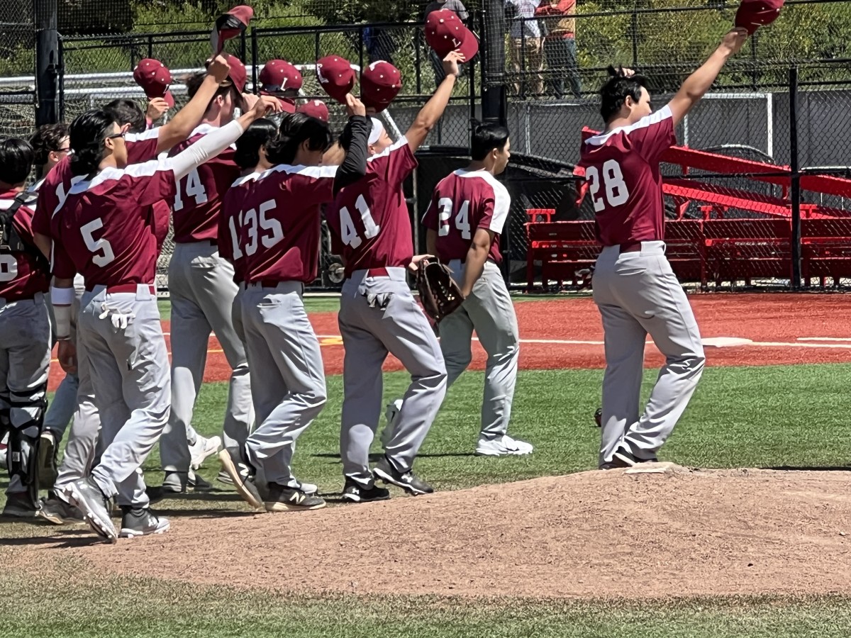 Lowell players salute their fans after Saturday's championship win over University. Photo: Mitch Stephens