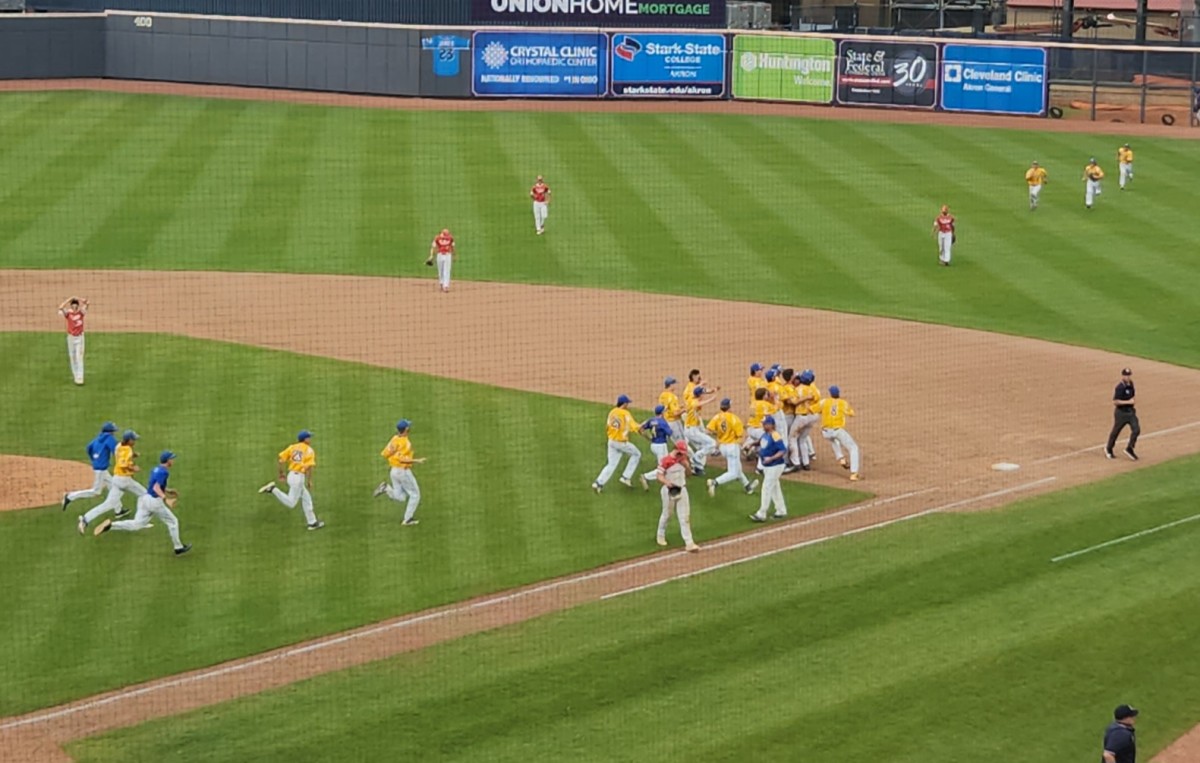 Russia players run onto the field to celebrate with Xavier Phlipot in the Division IV state semifinals after Phlipot hit  a walk-off TRBI single to beat St. Henry 1-0. (Photo: Ryan Isley)