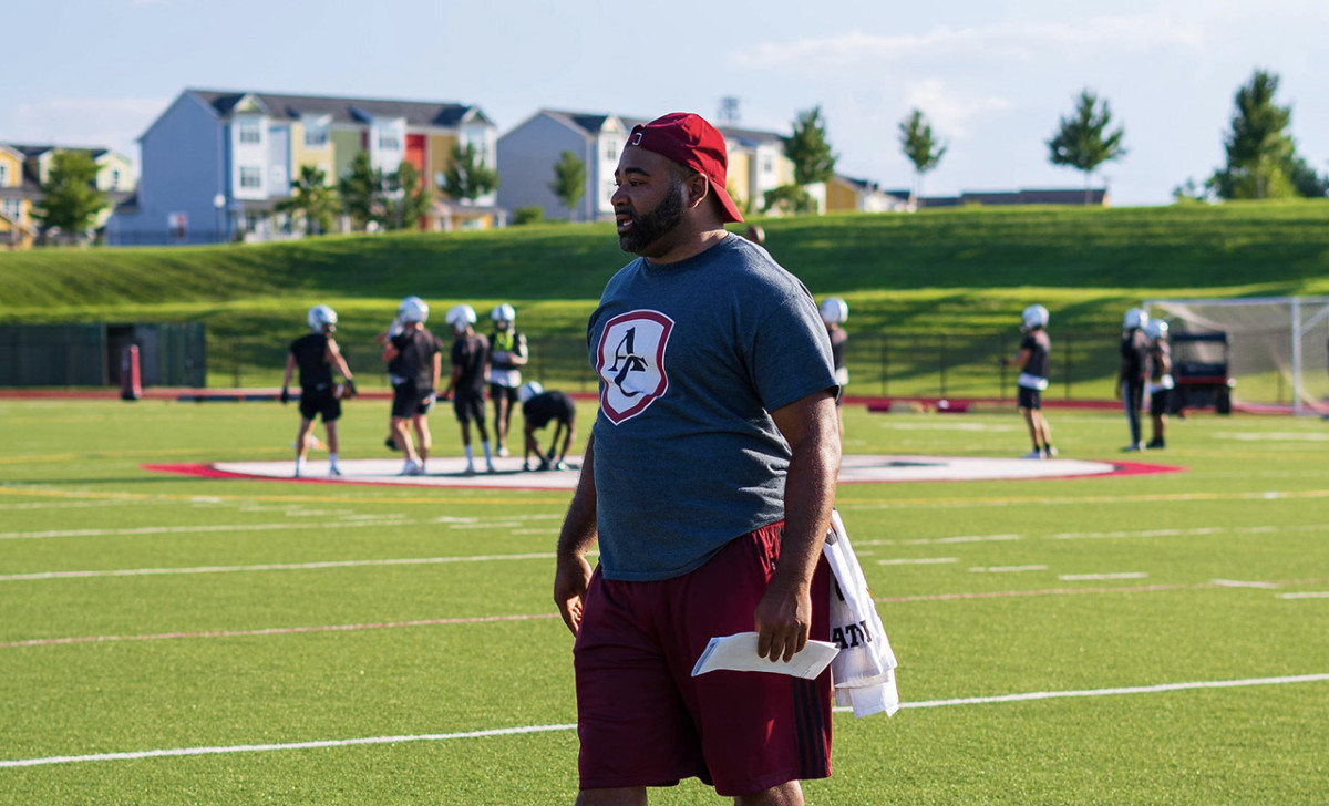Domonya Womack was a football star at Archbishop Curley prior to his graduation in 2011. After serving as a defensive assistant with the Friars last season, he has named the school's new head coach.