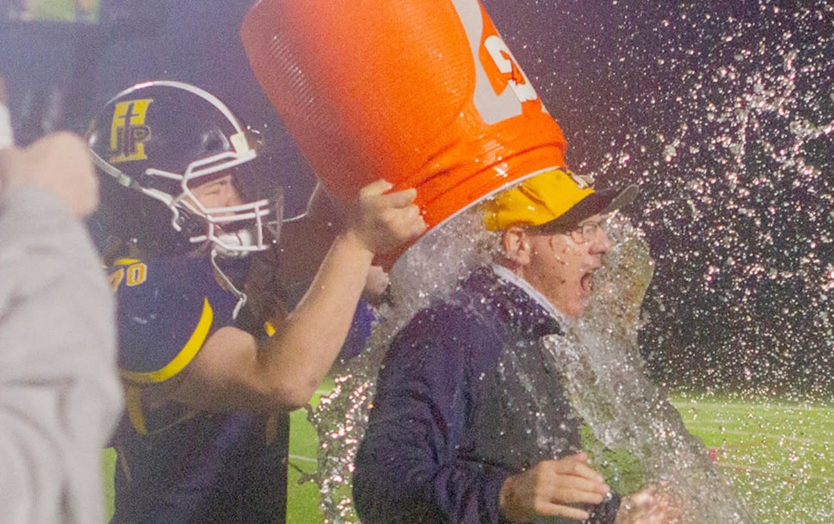 Sean Murphy got the obligatory Gatorade shower after leading the Saints to their first state playoff win in football in 2020. (Photo courtesy of John Paul II High School)