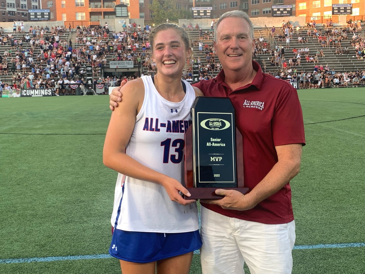 Peep Williams of Seton Catholic, New York, who will play her college lacrosse at Stanford University, scored a game-high four goals for the victorious North squad and was named the game's MVP. She accepted her award from Lee Corrigan, President of Corrigan Sports Enterprises, the game's promoter.