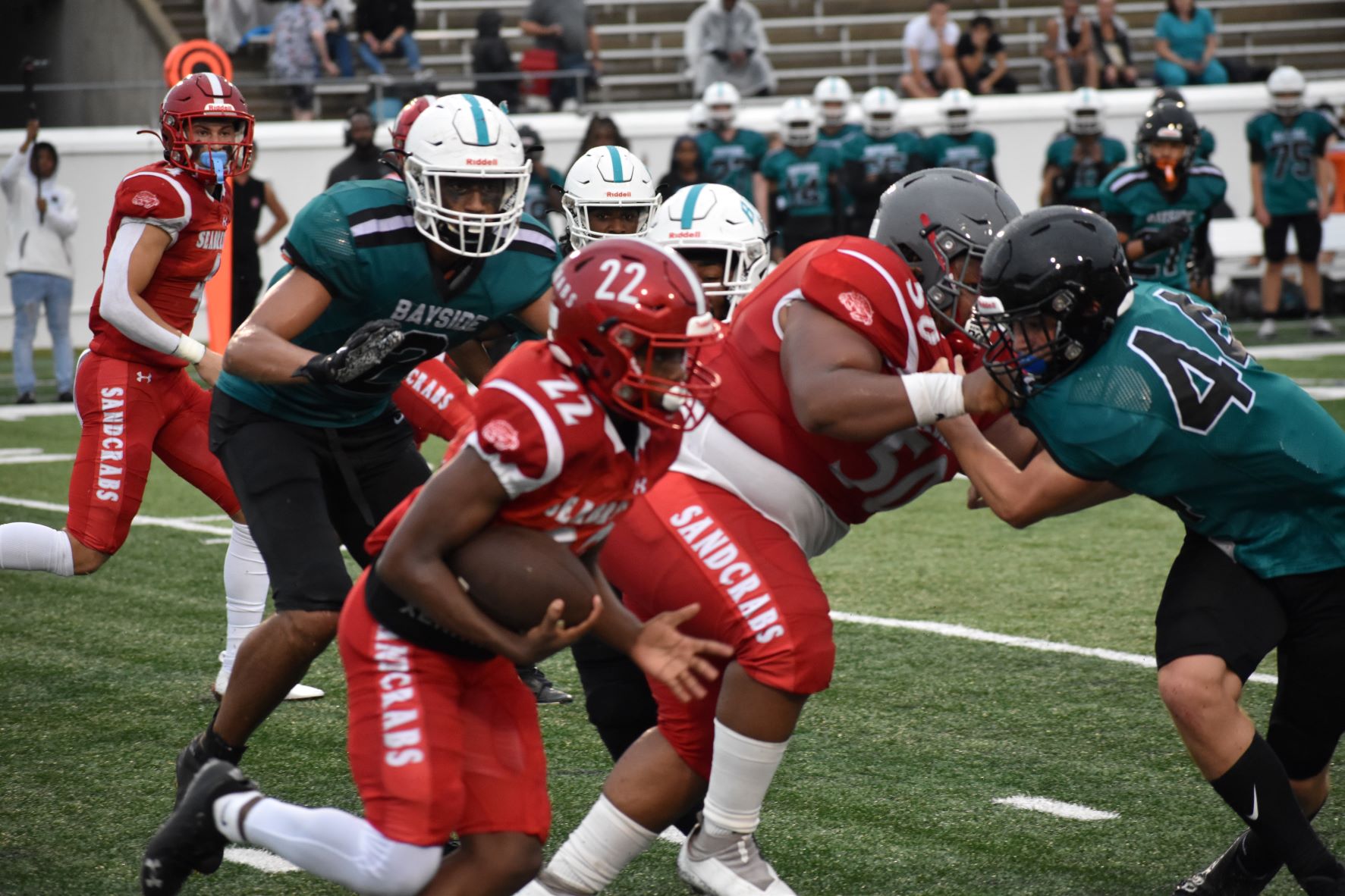 Seabreeze running back Tyrone Cordare (22) looks for an opening in Bayside's defense as the two teams battle in the Kickoff Classic preseason contest.