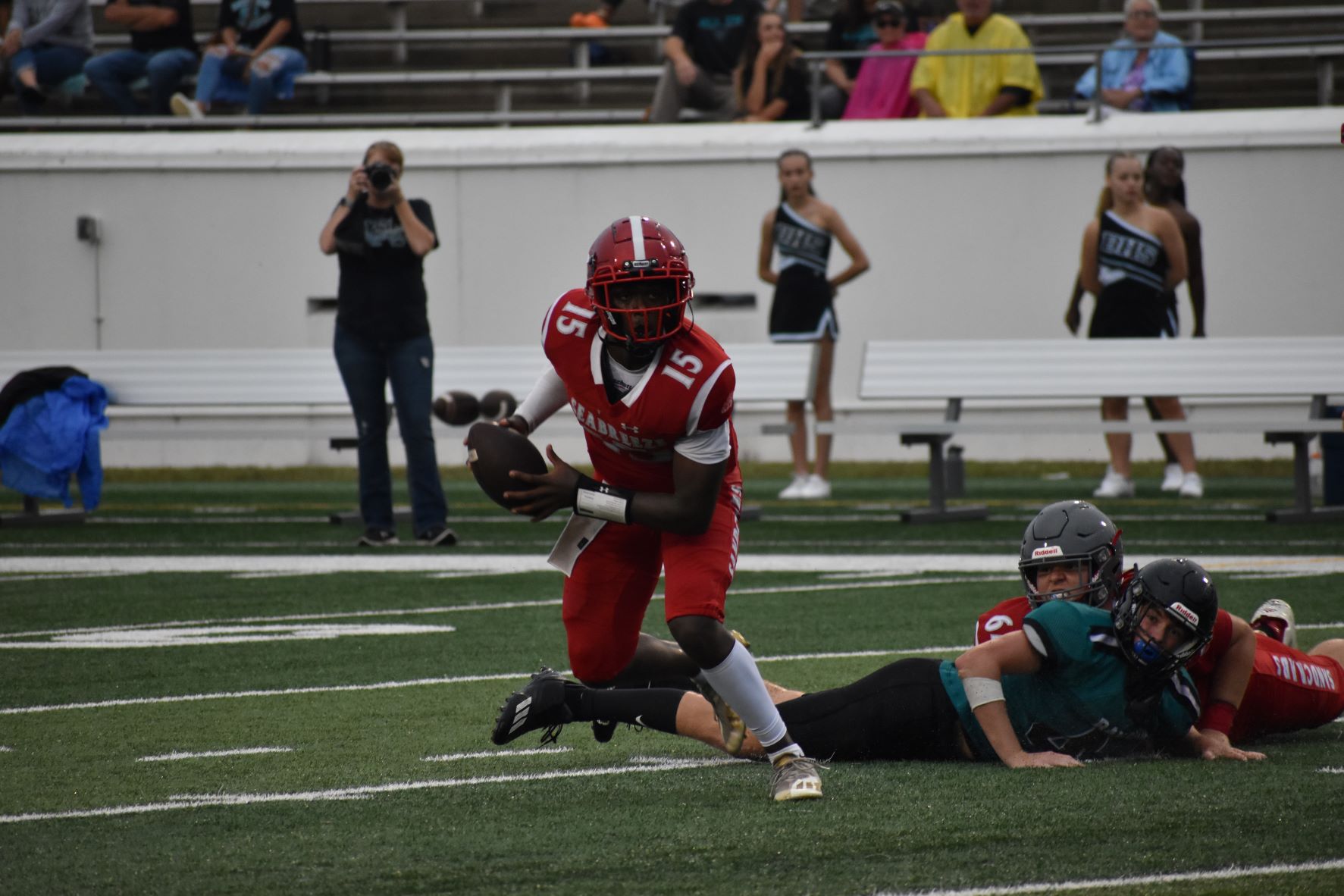 Seabreeze quarterback Zeli Hayworth (15), one of two Sandcrabs vying for the full-time starting job, looks for running room against Bayside in the Kickoff Classic.