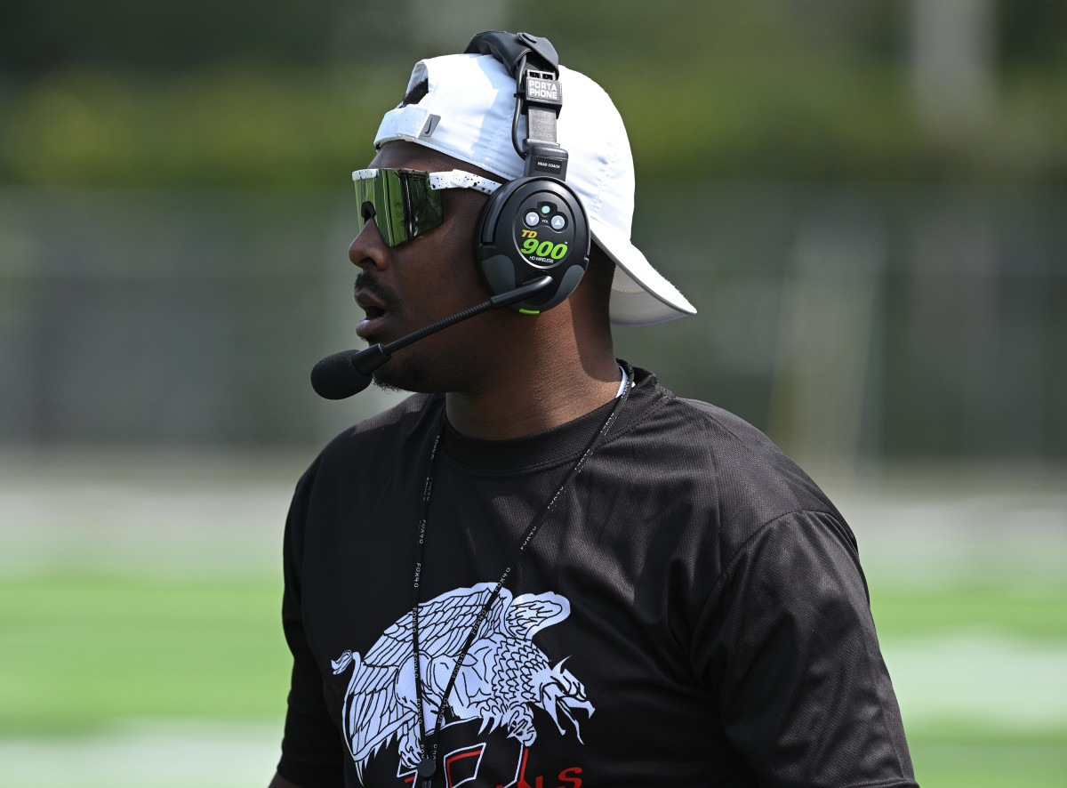 Buchtel football coach Bryan Williams works the sidelines in a game in 2022. Photo: Jeff Harwell