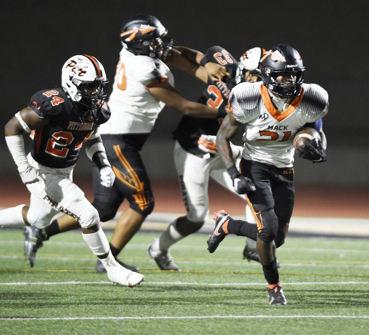 McClymonds' senior RB Jaivian Thomas (21) rushed for 165 yards and two touchdowns. Photo: Eric Taylor.