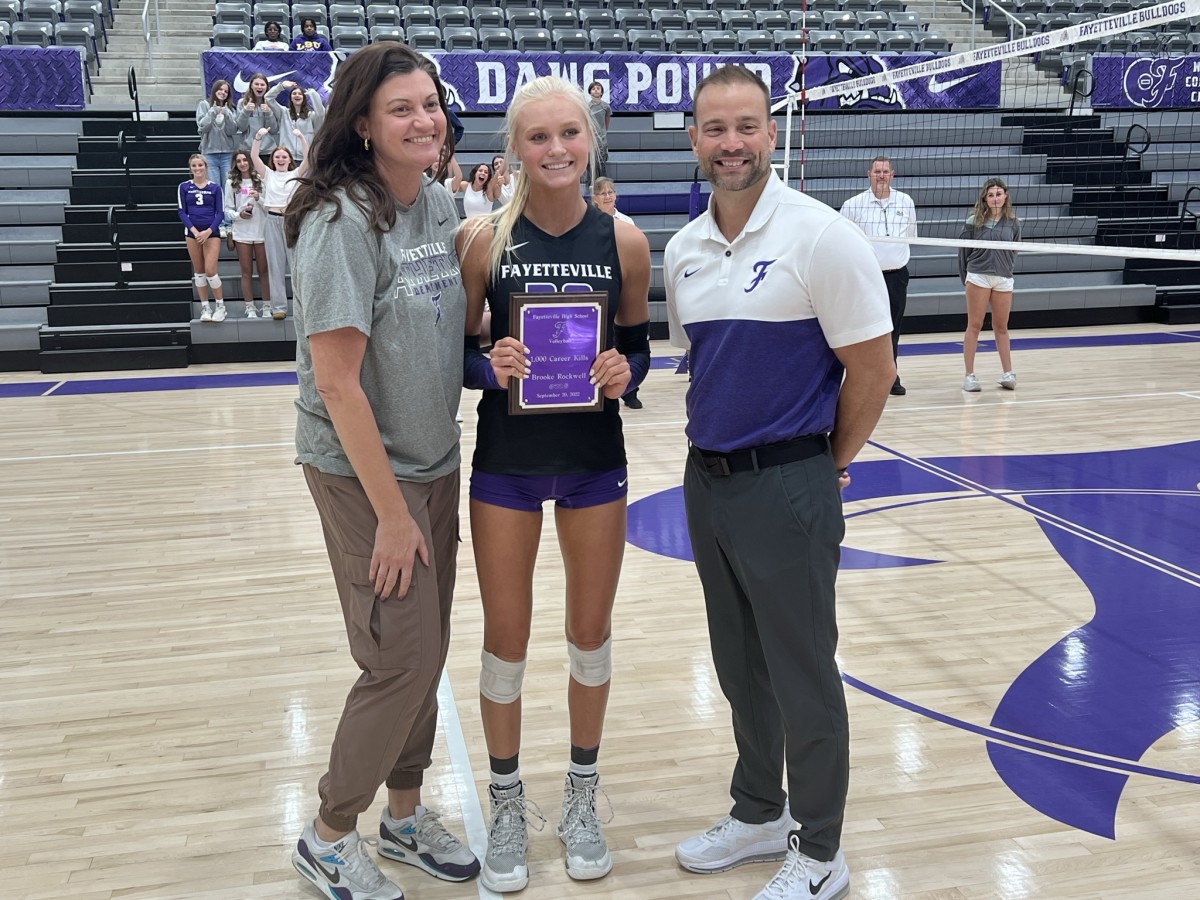(Photo by Steve Andrews) Fayetteville head volleyball coach Jessica Phelan (left) pictured with FHS senior Brooke Rockwell and FHS athletic director Steve Janski. Rockwell, who will be playing beach volleyball at Stanford University, was honored recently for recording 1,000 career kills.  