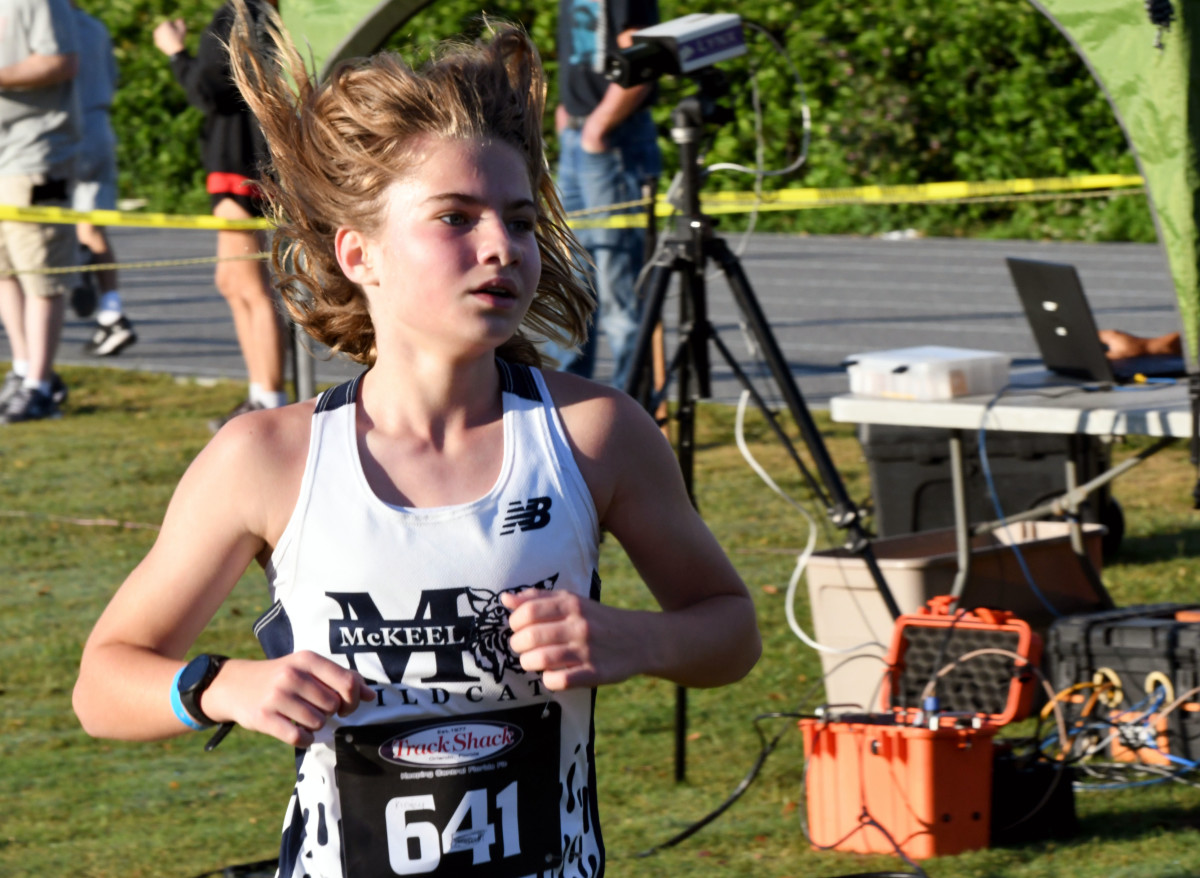 McKeel Academy seventh-grader Kinsey Myers crossed the finish line to win the girls leg of the Polk County cross country meet on Saturday at Lake Region High School.
