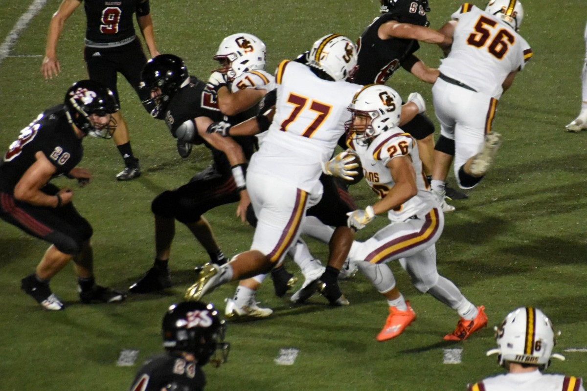 Gibson Southern freshman offensive lineman Spencer Staggs (77) clears a path for senior running back Devan Roberts. (Photo courtesy of the Staggs family)