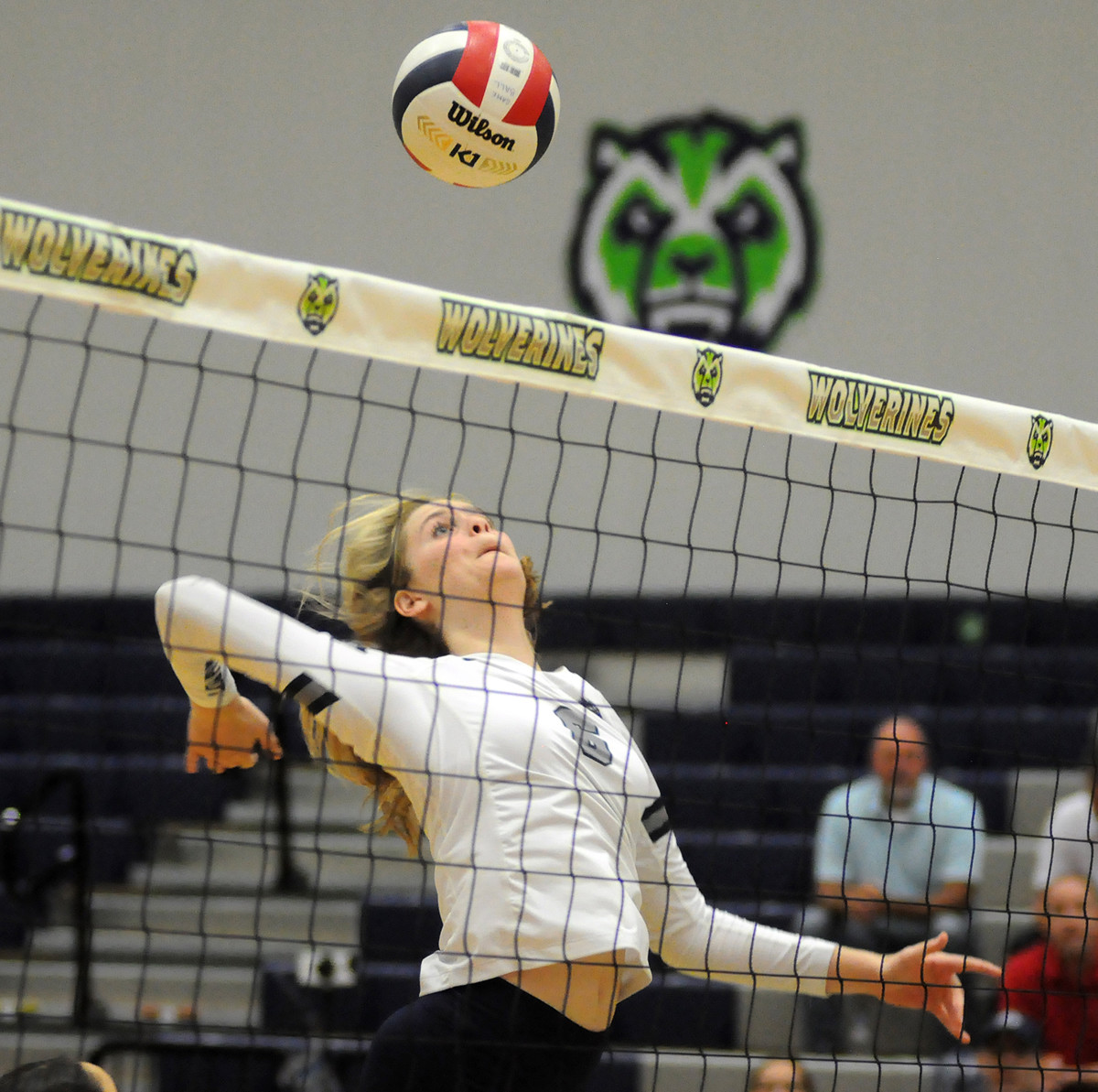 Lake Nona's Reagan McConomy goes for an overpass kill during the first set against Windermere.