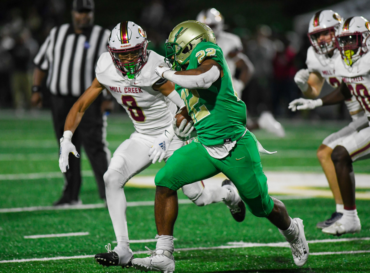 Alabama commit Justin Haynes dashes for some of his 216 yards rushing as he helped Buford pull away for a 39-27 win over Mill Creek.