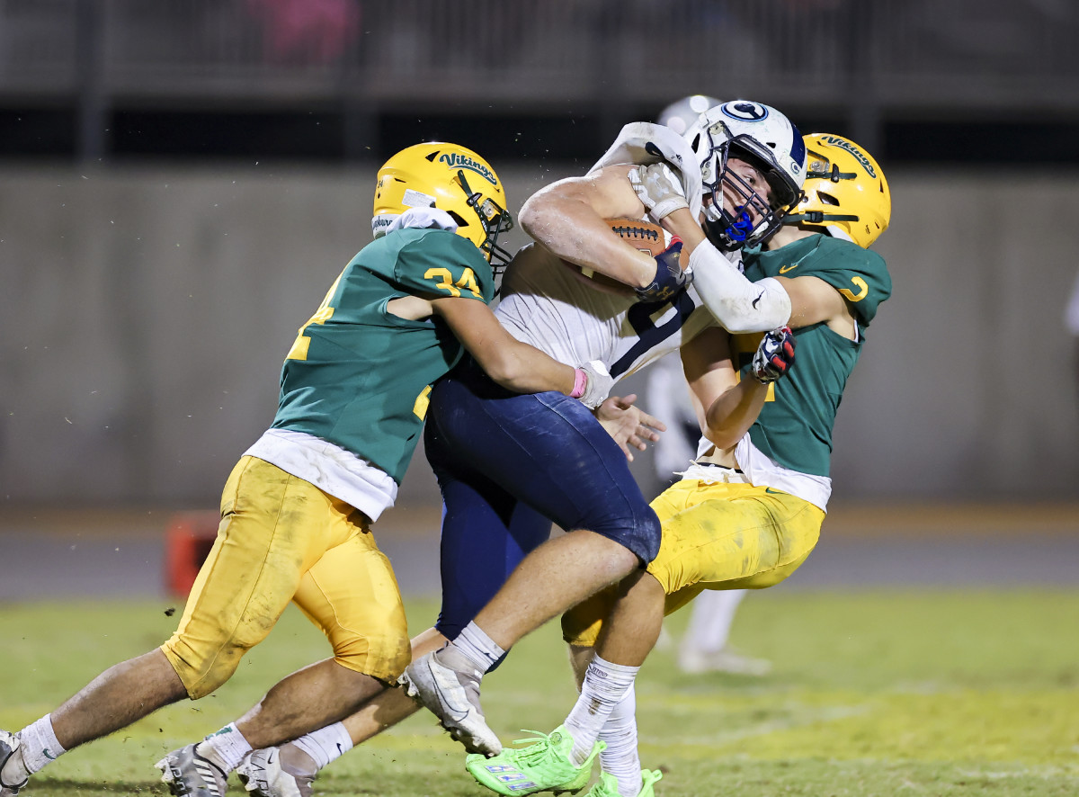 Kingsburg, in the green and gold show here last season vs. Central Valley Christian, will have a tough time slowing down Tulare Union. Photo: Richard Posada.