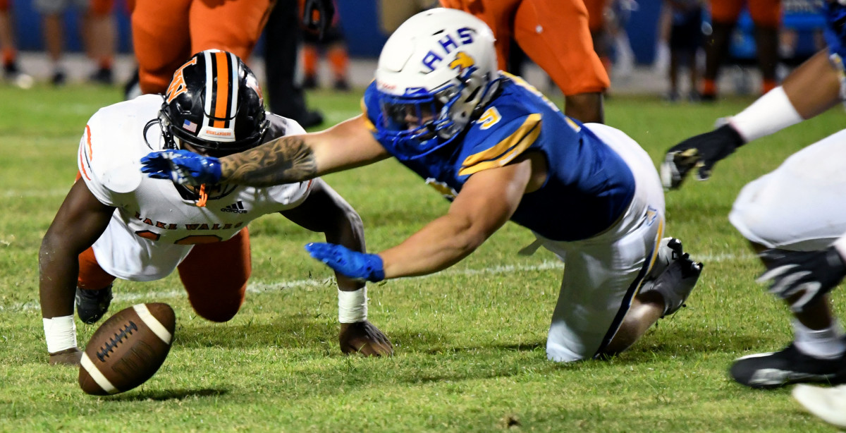 Auburndale linebacker Chandler Locklear pounces on a Lake Wales fumble in the first quarter of the 3S District 8 championship game at Auburndale on Friday at Bruce Canova Stadium.