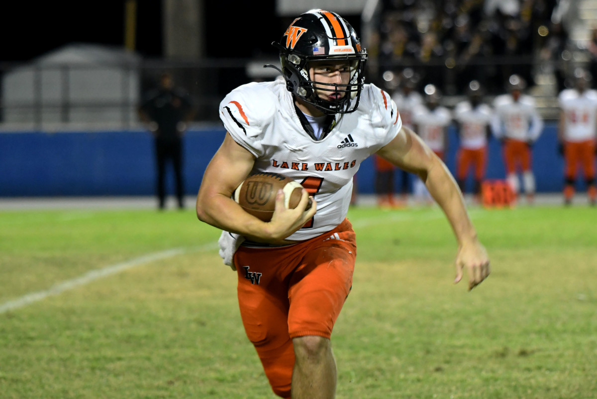 Lake Wales quarterback Trent Grotjan looks for running room during the 3S District 8 championship game at Auburndale on Friday at Bruce Canova Stadium.