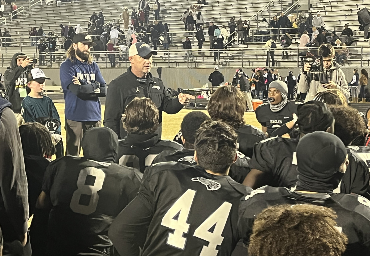 East Forsyth head coach Todd Willert addresses his squad following their 53-7 win over West Forsyth as the Eagles complete the regular season at 10-0.
