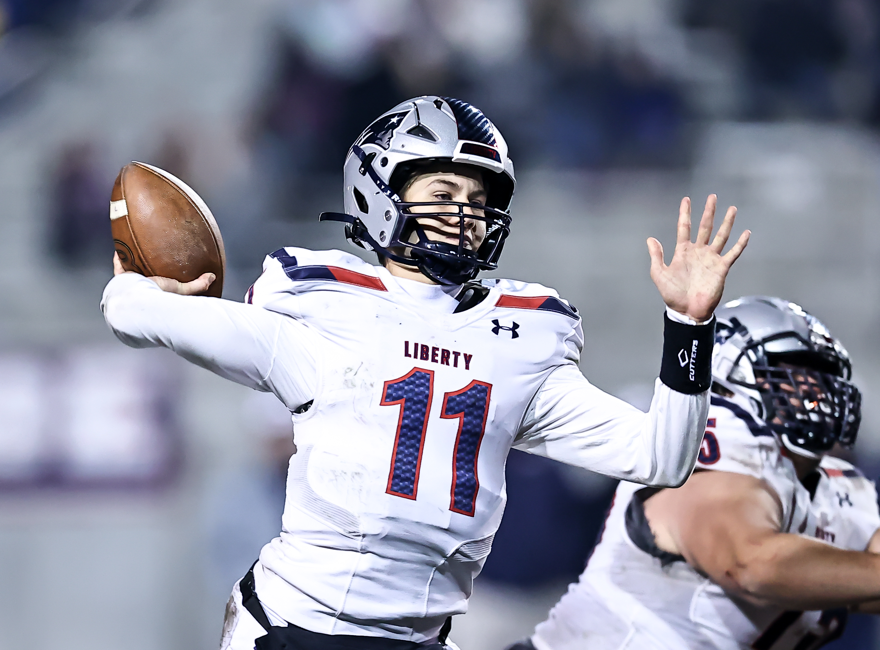 Cole O'Brien (11) accounted for four touchdowns for Liberty. Photo: Bobby Medellin