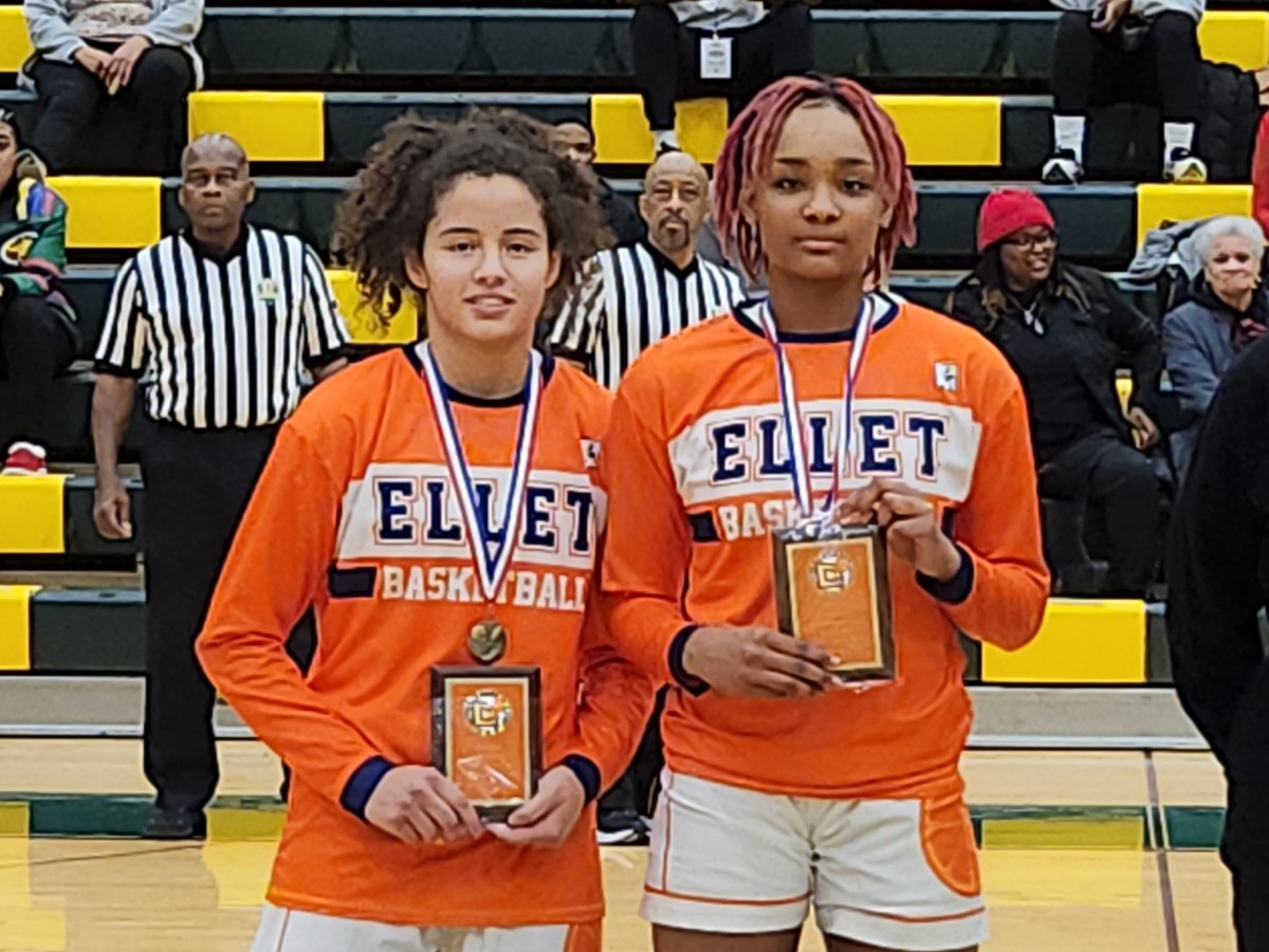 Ellet's Caitlyn Holmes, left, and Sanaiiya Gray receive their Akron City Series Player of the Year and Defensive Player of the Year awards on Jan. 31, 2024.